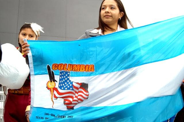 NASA image: KENNEDY SPACE CENTER, FLA. - Some of the dancers from the Shoshone-Bannock Junior-Senior High School, Fort Hall, Idaho, hold a flag commemorating the orbiter Columbia and her crew.  The dancers performed a healing ceremony during the memorial service held at the Space Memorial Mirror for the crew of Columbia.  Students and staff of the Shoshone-Bannock Nation had an experiment on board Columbia.  Feb. 1 is the one-year anniversary of the loss of the crew and orbiter Columbia in a tragic accident as the ship returned to Earth following mission STS-107. The public was invited to the memorial service, held in the KSC Visitor Complex, which included comments by Center Director Jim Kennedy and Executive Director of Florida Space Authority Winston Scott.  Scott is a former astronaut who flew on Columbia in 1997.