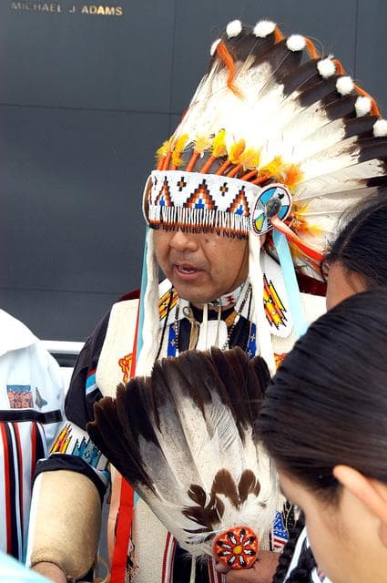 NASA image: KENNEDY SPACE CENTER, FLA. - Dancers from the Shoshone-Bannock Junior-Senior High School, Fort Hall, Idaho, perform a healing ceremony during the memorial service held at the Space Memorial Mirror for the crew of Columbia.  Feb. 1 is the one-year anniversary of the loss of the crew and orbiter Columbia in a tragic accident as the ship returned to Earth following mission STS-107.  Students and staff of the Shoshone-Bannock Nation had an experiment on board Columbia. The public was invited to the memorial service, held in the KSC Visitor Complex, which included comments by Center Director Jim Kennedy and Executive Director of Florida Space Authority Winston Scott.  Scott is a former astronaut who flew on Columbia in 1997.