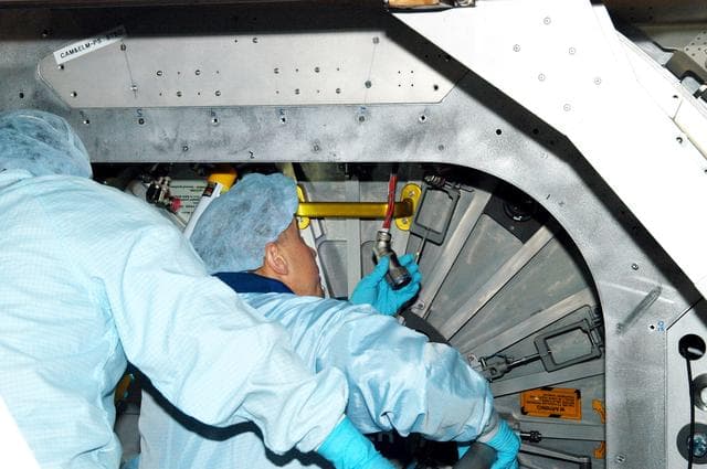 KENNEDY SPACE CENTER, FLA. - Astronaut Tim Kopra aids in Intravehicular Activity (IVA) constraints testing on the Italian-built Node 2, a future element of the International Space Station.  The second of three Station connecting modules, the Node 2 attaches to the end of the U.S. Lab and provides attach locations for several other elements.  Kopra is currently assigned technical duties in the Space Station Branch of the Astronaut Office, where his primary focus involves the testing of crew interfaces for two future ISS modules as well as the implementation of support computers and operational Local Area Network on ISS.   Node 2 is scheduled to launch on mission STS-120, Station assembly flight 10A.