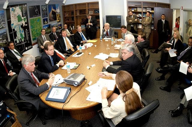 NASA image: KENNEDY SPACE CENTER, FLA. - NASA and government officials are gathered to hear about the assets of the Central Florida Research Park, near Orlando, as the site of NASA’s new Shared Services Center.  Six sites around the U.S. are under consideration.  At the far end is NASA Administrator Sean O’Keefe.  He is flanked, on the left, by Florida Congressman Tom Feeney and U.S. Senator Bill Nelson; and on the right by U.S. Congressman Dave Weldon and U.S. Representative Ric Keller.  In the foreground, at left, is Center Director Jim Kennedy.  At right is  Pamella J. Dana, Ph.D., director, Office of Tourism, Trade, and Economic Development in Florida.  The center would centralize NASA’s payroll, accounting, human resources, facilities and procurement offices that are now handled at each field center.  The consolidation is part of the One NASA focus.
