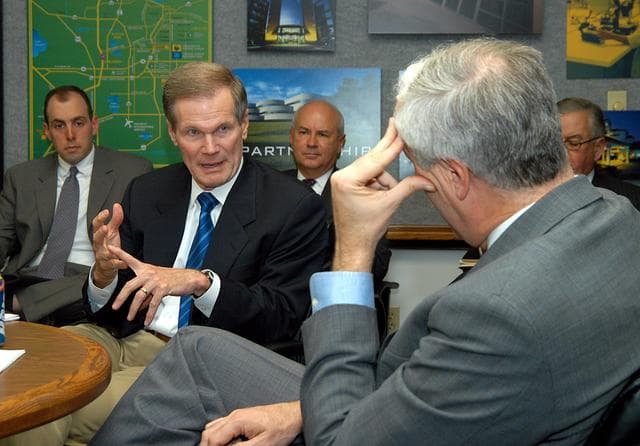 NASA image: KENNEDY SPACE CENTER, FLA. - U.S. Senator Bill Nelson (center) makes a point while talking to NASA Administrator Sean O’Keefe (right) about the assets of the Central Florida Research Park, near Orlando, as the site of NASA’s new Shared Services Center. Six sites around the U.S. are under consideration for location of the Center, which would centralize NASA’s payroll, accounting, human resources, facilities and procurement offices that are now handled at each field center.  The consolidation is part of the One NASA focus.  Others attending the presentation included Congressman Tom Feeney, Congressman Dave Weldon, U.S. Representative Ric Keller, Center Director Jim Kennedy and Pamella J. Dana, Ph.D., director, Office of Tourism, Trade, and Economic Development in Florida.