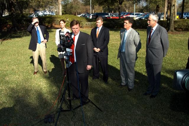 NASA image: KENNEDY SPACE CENTER, FLA. - - U.S. Representative Ric Keller talks to the media at the Central Florida Research Park, near Orlando.  He, NASA Administrator Sean O’Keefe and government officials were at the park for a presentation about the assets of the research park as the site of NASA’s new Shared Services Center. Behind Keller are (left to right) U.S. Senator Bill Nelson; Pamella J. Dana, Ph.D., director, Office of Tourism, Trade, and Economic Development in Florida; Florida Congressman Tom Feeney; Congressman Dave Weldon; and O’Keefe.  Six sites around the U.S. are under consideration for location of the Center, which would centralize NASA’s payroll, accounting, human resources, facilities and procurement offices that are now handled at each field center.  The consolidation is part of the One NASA focus.  Center Director Jim Kennedy also attended the presentation.