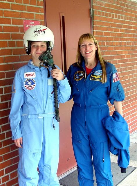 NASA image: KENNEDY SPACE CENTER, FLA. - Astronaut Kay Hire poses with 8th grader Kristy Wiggins at Garland V. Stewart Magnet Middle School, a NASA Explorer School (NES) in Tampa, Fla.  Hire joined Center Director Jim Kennedy at the school in sharing the agency’s new vision for space exploration with the next generation of explorers. Kennedy is talking with students about our destiny as explorers, NASA’s stepping stone approach to exploring Earth, the Moon, Mars and beyond, how space impacts our lives, and how people and machines rely on each other in space.