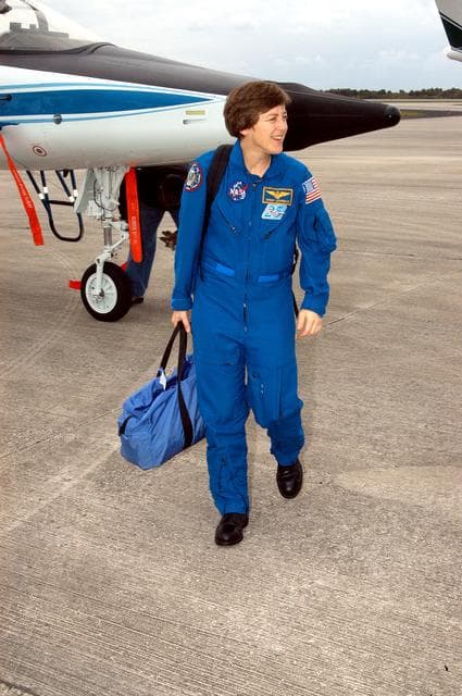 NASA image: KENNEDY SPACE CENTER, FLA. - STS-114 Mission Specialist Wendy Lawrence is pleased to be back at KSC after arriving aboard a T-38 jet aircraft.  She and other crew members are at the Center for familiarization activities with equipment.   The mission is Logistics Flight 1, scheduled to deliver the Multi-Purpose Logistics Module carrying supplies and equipment to the Space Station and the external stowage platform.