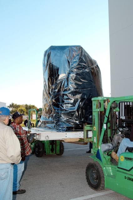 NASA image: KENNEDY SPACE CENTER, FLA. -  At the Astrotech Space Operations processing facilities near KSC, a lift begins lowering NASA’s MESSENGER spacecraft onto the ground.  MESSENGER - short for MErcury Surface, Space ENvironment, GEochemistry and Ranging - will be taken into a high bay clean room and employees of the Johns Hopkins University Applied Physics Laboratory, builders of the spacecraft, will perform an initial state-of-health check.  Then processing for launch can begin, including checkout of the power systems, communications systems and control systems.  The thermal blankets will also be attached for flight.  MESSENGER will be launched May 11 on a six-year mission aboard a Boeing Delta II rocket.  Liftoff is targeted for 2:26 a.m. EDT on Tuesday, May 11.
