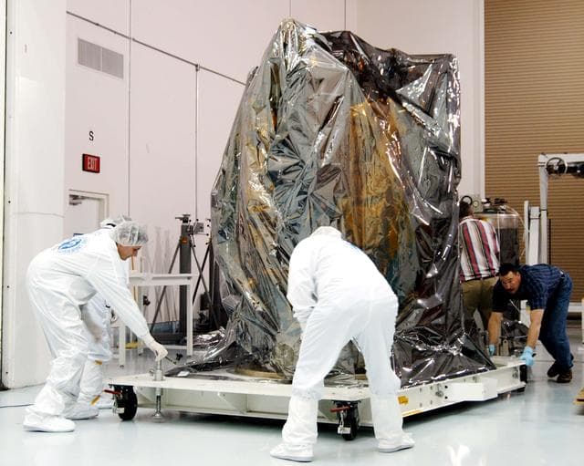 NASA image: KENNEDY SPACE CENTER, FLA. -  At the Astrotech Space Operations processing facilities near KSC, workers move NASA’s MESSENGER spacecraft into a high bay clean room.  Employees of the Johns Hopkins University Applied Physics Laboratory, builders of the spacecraft, will perform an initial state-of-health check.  Then processing for launch can begin, including checkout of the power systems, communications systems and control systems.  The thermal blankets will also be attached for flight.  MESSENGER - short for MErcury Surface, Space ENvironment, GEochemistry and Ranging - will be launched May 11 on a six-year mission aboard a Boeing Delta II rocket.  Liftoff is targeted for 2:26 a.m. EDT on Tuesday, May 11.