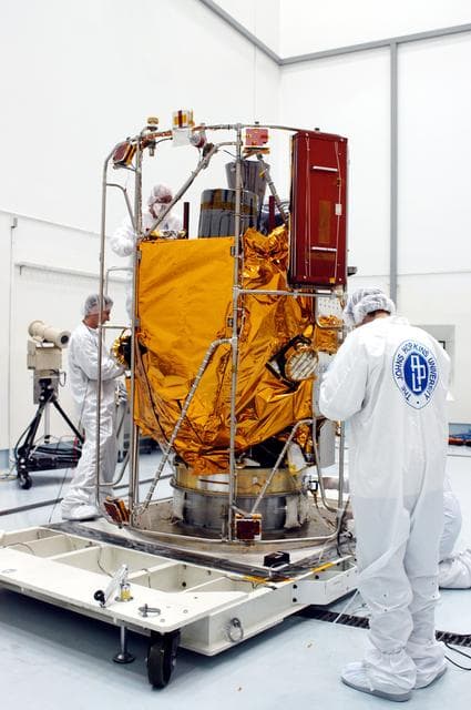 NASA image: KENNEDY SPACE CENTER, FLA. -  In the high bay clean room at the Astrotech Space Operations processing facilities near KSC, NASA’s MESSENGER spacecraft is revealed.  Employees of the Johns Hopkins University Applied Physics Laboratory, builders of the spacecraft, will perform an initial state-of-health check.  Then processing for launch can begin, including checkout of the power systems, communications systems and control systems.  The thermal blankets will also be attached for flight.  MESSENGER - short for MErcury Surface, Space ENvironment, GEochemistry and Ranging - will be launched May 11 on a six-year mission aboard a Boeing Delta II rocket.  Liftoff is targeted for 2:26 a.m. EDT on Tuesday, May 11.