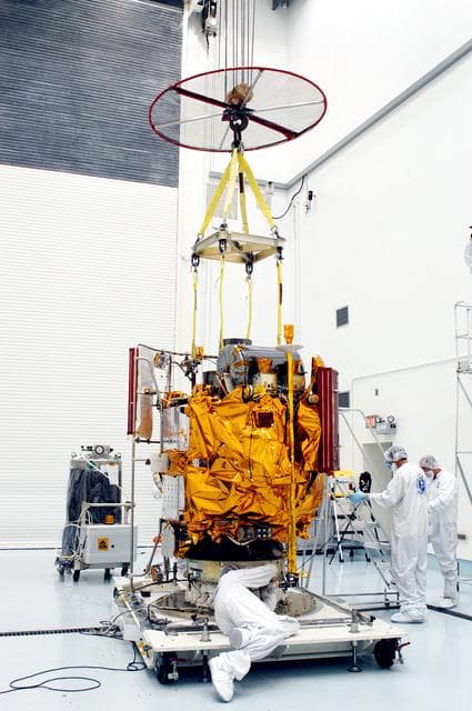 NASA image: KENNEDY SPACE CENTER, FLA. -  In the high bay clean room at the Astrotech Space Operations processing facilities near KSC, workers attach an overhead crane to NASA’s MESSENGER spacecraft.  The spacecraft will be moved to a work stand where employees of the Johns Hopkins University Applied Physics Laboratory, builders of the spacecraft, will perform an initial state-of-health check.  Then processing for launch can begin, including checkout of the power systems, communications systems and control systems.  The thermal blankets will also be attached for flight.  MESSENGER - short for MErcury Surface, Space ENvironment, GEochemistry and Ranging - will be launched May 11 on a six-year mission aboard a Boeing Delta II rocket.  Liftoff is targeted for 2:26 a.m. EDT on Tuesday, May 11.