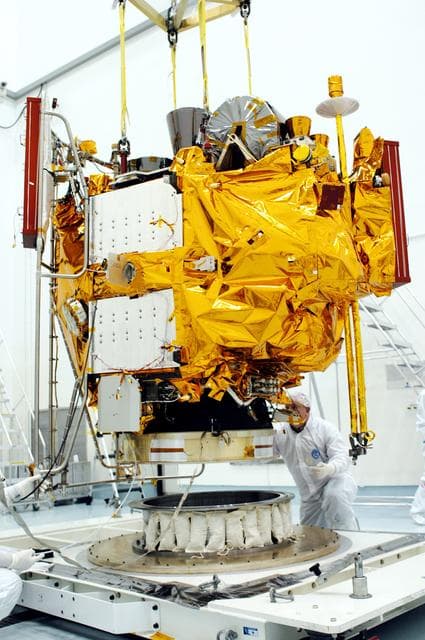 NASA image: KENNEDY SPACE CENTER, FLA. -  At the Astrotech Space Operations processing facilities, NASA’s MESSENGER spacecraft is lifted off the pallet for transfer to a work stand. There employees of the Johns Hopkins University Applied Physics Laboratory, builders of the spacecraft, will perform an initial state-of-health check.  Then processing for launch can begin, including checkout of the power systems, communications systems and control systems.  The thermal blankets will also be attached for flight.  MESSENGER - short for MErcury Surface, Space ENvironment, GEochemistry and Ranging - will be launched May 11 on a six-year mission aboard a Boeing Delta II rocket.  Liftoff is targeted for 2:26 a.m. EDT on Tuesday, May 11.
