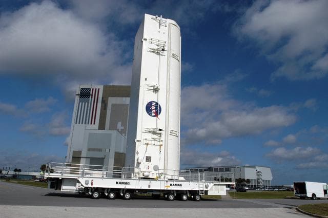 NASA image: Payload Bay Canister being transported to Pad 39A for a fit chec
