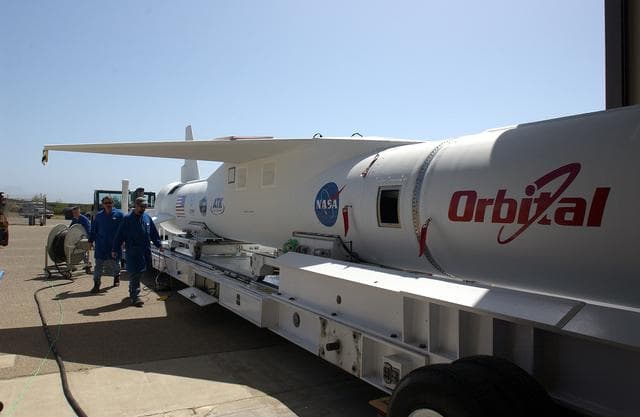 NASA image: The mated Pegasus XL rocket - AIM spacecraft leaves Building 165