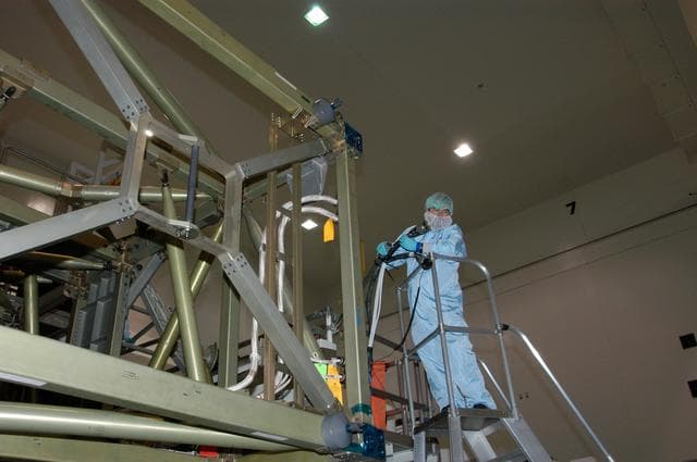 NASA image: Workers prepare to connect cables that will recharge the battery