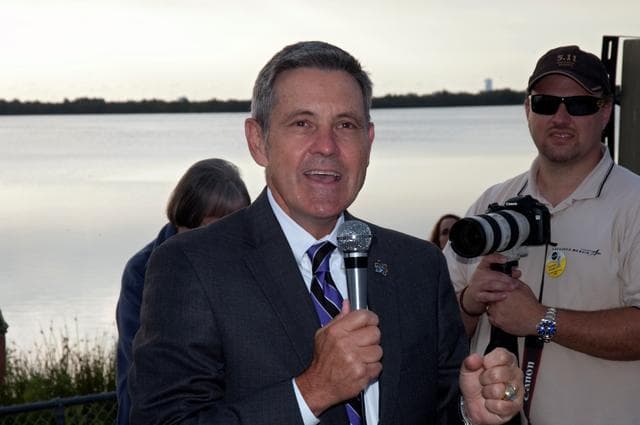 NASA image: CAPE CANAVERAL, Fla. - NASA Kennedy Space Center Director Bob Cabana talks to a crowd of spectators gathered at the Banana Creek Viewing Site near the Saturn V Center at NASA's Kennedy Space Center in Florida to watch the launch of space shuttle Endeavour. The shuttle lifted off on its STS-134 mission to the International Space Station on time at 8:56 a.m. EDT on May 16.    The shuttle and its six-member crew are embarking on a mission to deliver the Alpha Magnetic Spectrometer-2 (AMS), Express Logistics Carrier-3, a high-pressure gas tank and additional spare parts for the Dextre robotic helper to the space station. Endeavour's first launch attempt on April 29 was scrubbed because of an issue associated with a faulty power distribution box called the aft load control assembly-2 (ALCA-2). For more information, visit www.nasa.gov/mission_pages/shuttle/shuttlemissions/sts134/index.html. Photo credit: NASA/Kurtis Korwan