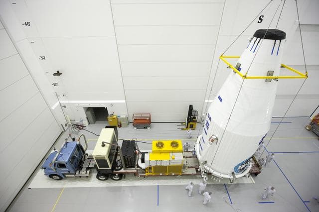 NASA image: TDRS-L Spacecraft is Lifted Onto Transporter