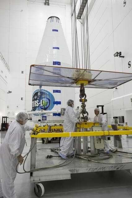 NASA image: TDRS-L Spacecraft is Lifted Onto Transporter