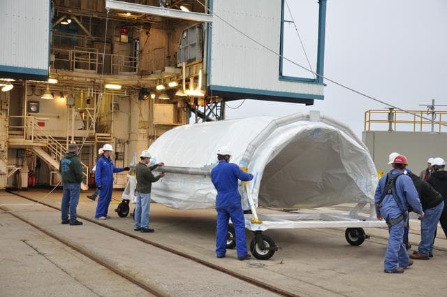 NASA image: OCO-2: Hoisting the Fairing Halves up the MST