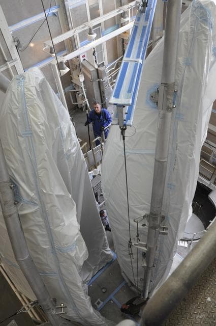 NASA image: OCO-2: Hoisting the Fairing Halves up the MST