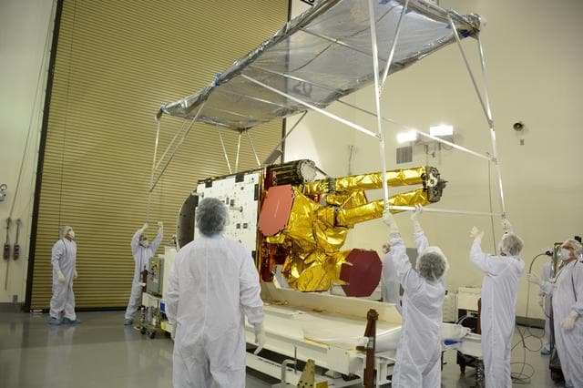 NASA image: SMAP Spacecraft Rotate & Placed on Fixture