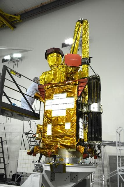 NASA image: SMAP Spacecraft Rotate & Placed on Fixture