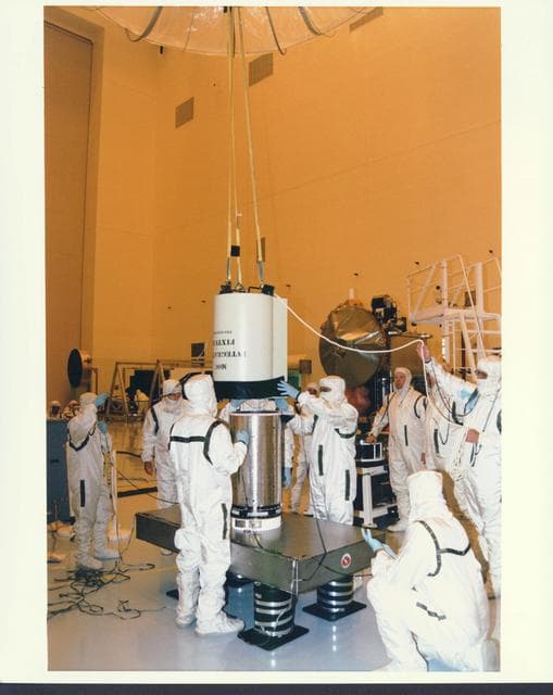 NASA image: KENNEDY SPACE CENTER, FLA. -  In the Payload Hazardous Servicing Facility at KSC, installation is under way of the Mars Orbiter Camera (MOC) on the Mars Global Surveyor spacecraft.  The MOC is one of a suite of six scientific instruments that will gather data about Martian topography, mineral distribution and weather during a two-year period.  The Mars Global Surveyor is slated for launch aboard a Delta II expendable launch vehicle on Nov. 6, the beginning of a 20-day launch period.