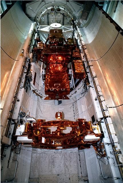 NASA image: KENNEDY SPACE CENTER, FLA. -   The Payload is seen inside of the Bay just before the doors are closed for flight at Pad 39A, Kennedy Space Center, Fla.  Discovery, the orbiter for STS-82 mission, is ready for the launch of the second Hubble Space Telescope service mission.  The payload consists of the Near Infrared Camera and Multi-Object Spectrometer (NICMOS) that will be installed, Fine Guidance Sensor #1 (FGS-1), and the Space Telescope Imaging Spectrograph (STIS) to be installed.  The STS-82 will launch with a crew of seven at 3:54 a.m. EST, Feb. 11, 1997.  The launch window is 65 minutes in duration.  The Mission Commander for STS-82 is Ken Bowersox.  The purpose of the mission is to upgrade the scientific capabilities, service or replace aging components on the Telescope, and provide a reboost to the optimum altitude.