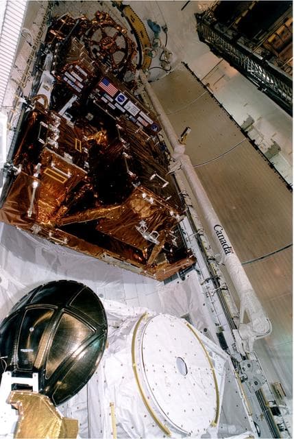 NASA image: KENNEDY SPACE CENTER, FLA. -  The Payload is seen inside of the Bay just before the doors are closed for flight at KSC's Launch Pad 39A.   Discovery, the orbiter for the STS-82 mission, is ready for the launch of the second Hubble Space Telescope service mission.  The payload consists of the Near Infrared Camera and Multi-Object Spectrometer (NICMOS) that will be installed, Fine Guidance Sensor #1 (FGS-1), and the Space Telescope Imaging Spectrograph (STIS) to be installed. The STS-82 will launch with a crew of seven at 3:54 a.m. EST, Feb. 11, 1997. The launch window is 65 minutes in duration. The Mission Commander for STS-82 is Ken Bowersox. The purpose of the mission is to upgrade the scientific capabilities, service or replace aging components on the Telescope, and provide a reboost to the optimum altitude.