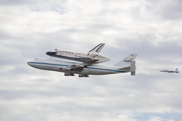 NASA image: Space Shuttle Discovery mounted atop a NASA 747 Shuttle Carrier 