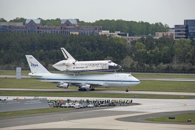 NASA image: Space Shuttle Discovery mounted atop a NASA 747 Shuttle Carrier 