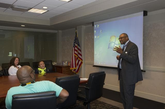 NASA image: Loucious Hires with students fro mthe Tennessee School for the Blind.