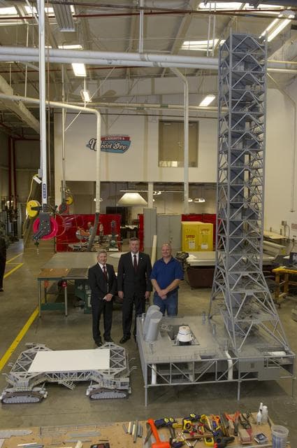 NASA image: Patrick Scheuermann and Johnny Stephenson tour the MSFC model shop