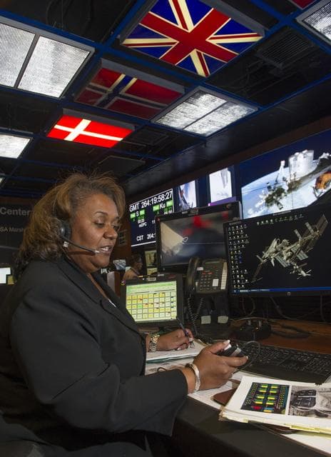 NASA image: Lybrease Woodard on console in the Payload Operations Integration Center.