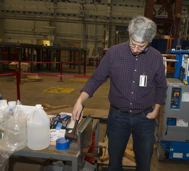 NASA image: MEASURING FLOW RATE OF EPOXY MIXTURE