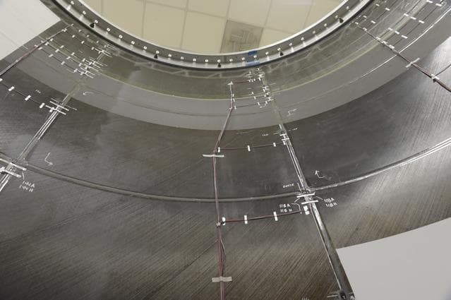 NASA image: INSTALLATION OF STRESS SENSORS TO SBKF COMPOSITE TANK