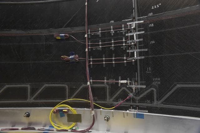 NASA image: INSTALLATION OF STRESS SENSORS TO SBKF COMPOSITE TANK