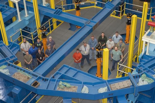 NASA image: SLS ENGINE SECTION TEST STAND WITH CONSTRUCTION CREW
