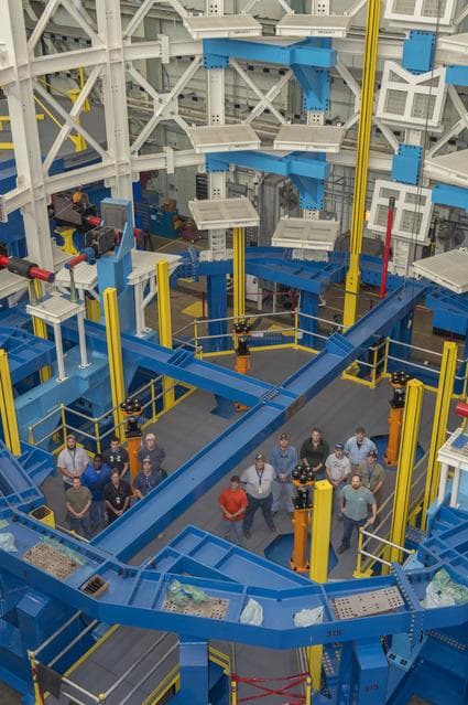 NASA image: SLS ENGINE SECTION TEST STAND WITH CONSTRUCTION CREW