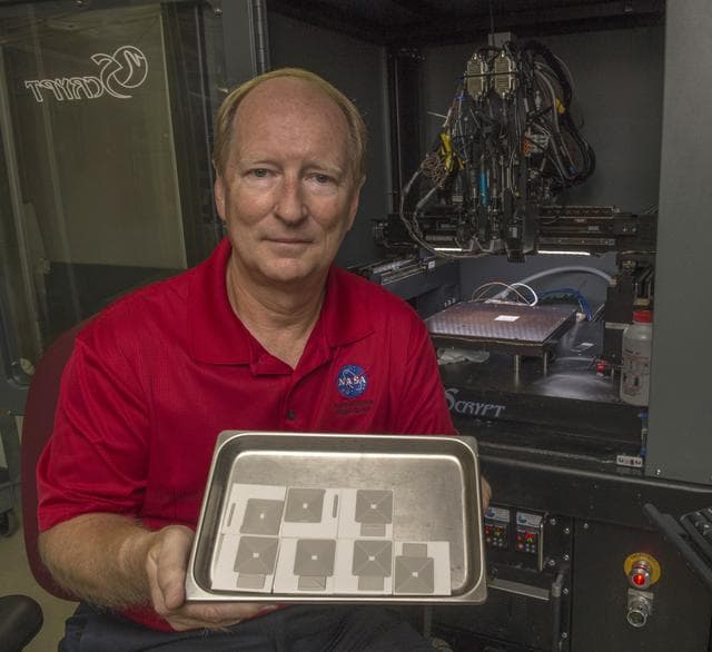 NASA image: Curtis Hill with printed silver antenna arrays