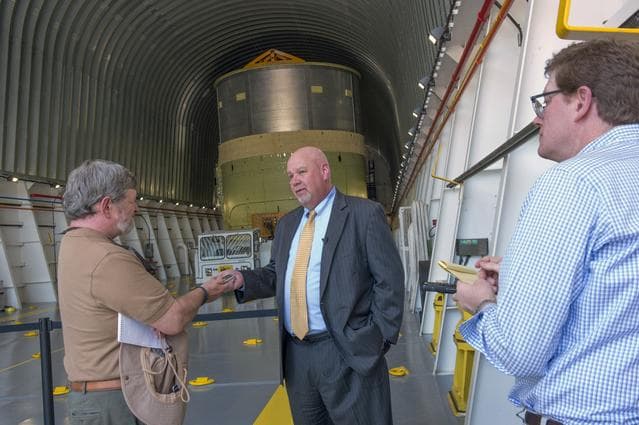 NASA image: John Honeycutt talks with reporters