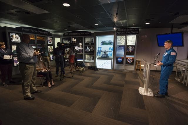 NASA image: Expedition 49/50 Astronaut Shane Kimbrough briefs the press on his extended mission to the International Space Station in the Marshall Space Flight Center Payload Operations Integration Center (POIC).