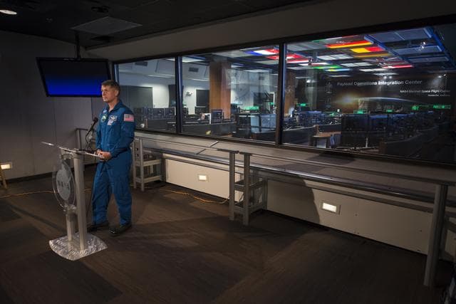NASA image: Expedition 49/50 Astronaut Shane Kimbrough briefs the press on his extended mission to the International Space Station in the Marshall Space Flight Center Payload Operations Integration Center (POIC).