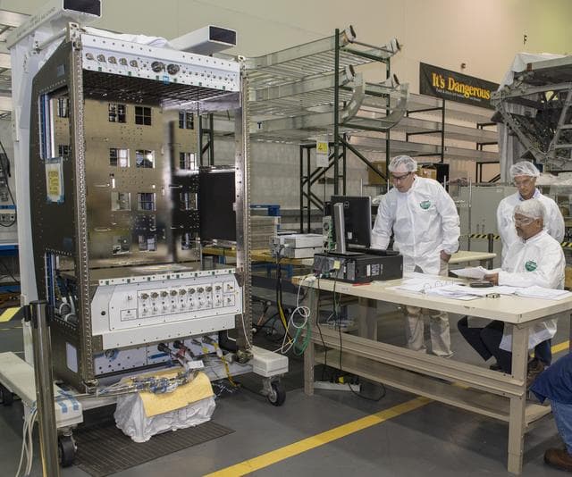 NASA image: Boeing engineers perform air flow balance testing.