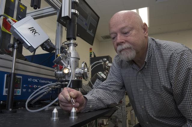 NASA image:   Dr. Douglas Matson (Tufts University) working with an aerodyna