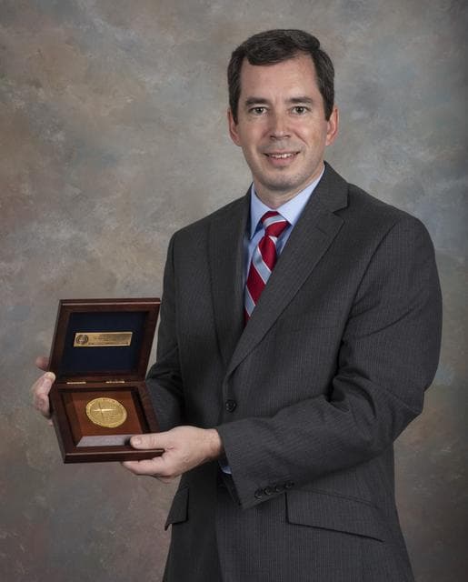 NASA image: Phillip Allen with NASA Software of the Year Award