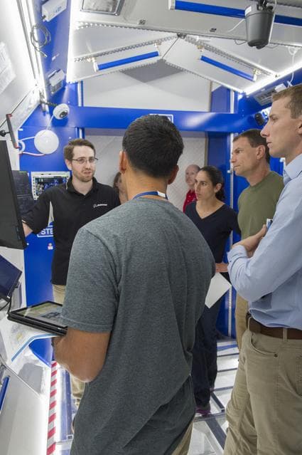 NASA image: Boeing trainers conduct simulations inside the Boeing Exploratio