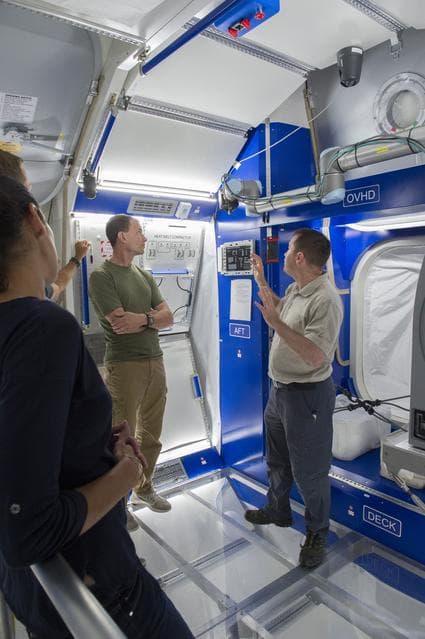 NASA image: Boeing trainers conduct simulations inside the Boeing Exploratio