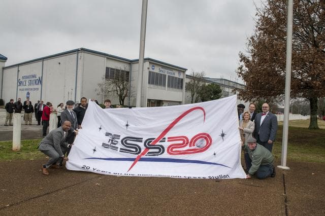 NASA image: Associate Administrator Douglas Loverro Participates in the Hanging of the ISS Flag