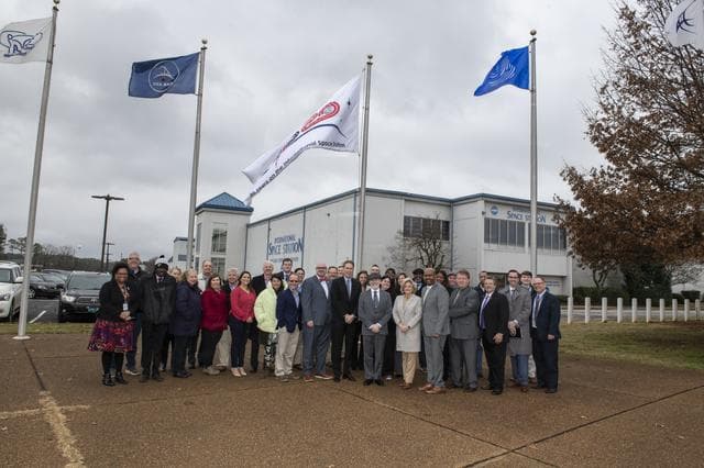 NASA image: Associate Administrator Douglas Loverro Participates in the Hanging of the ISS Flag