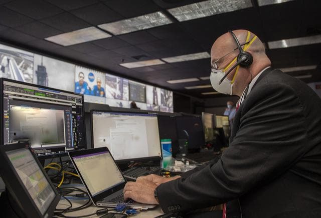 NASA image: Paul Crawford and Teams at NASA’s Marshall Space Flight Center help monitor launch conditions for the Demo-2 mission from the Huntsville Operations Support Center, HOSC.