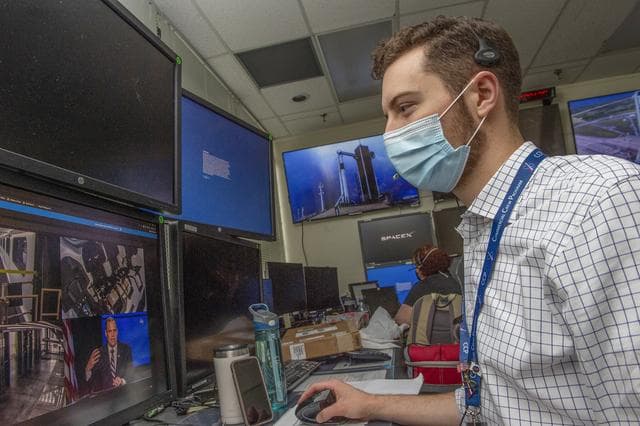 NASA image: Reid Ruggles and teams at NASA’s Marshall Space Flight Center help monitor launch conditions for the Demo-2 mission from the Huntsville Operations Support Center, HOSC.