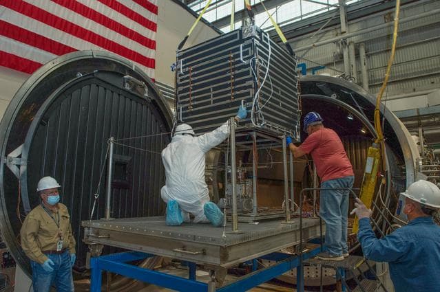 NASA image:  Opening Thermal Vacuum Chamber V15 to extract hot box 2 of 2containing NEA Scout spacecraft.